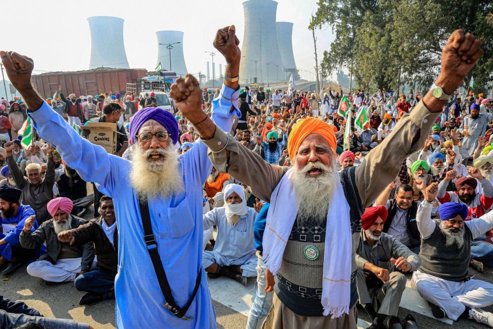 Bathinda: Bharatiya Kisan Union (BKU) activists block NH-15 in support of the nationwide strike, called by farmers to press for repeal of the Centre's Agri laws, in Bathinda, Tuesday, Dec. 8, 2020. (PTI Photo)